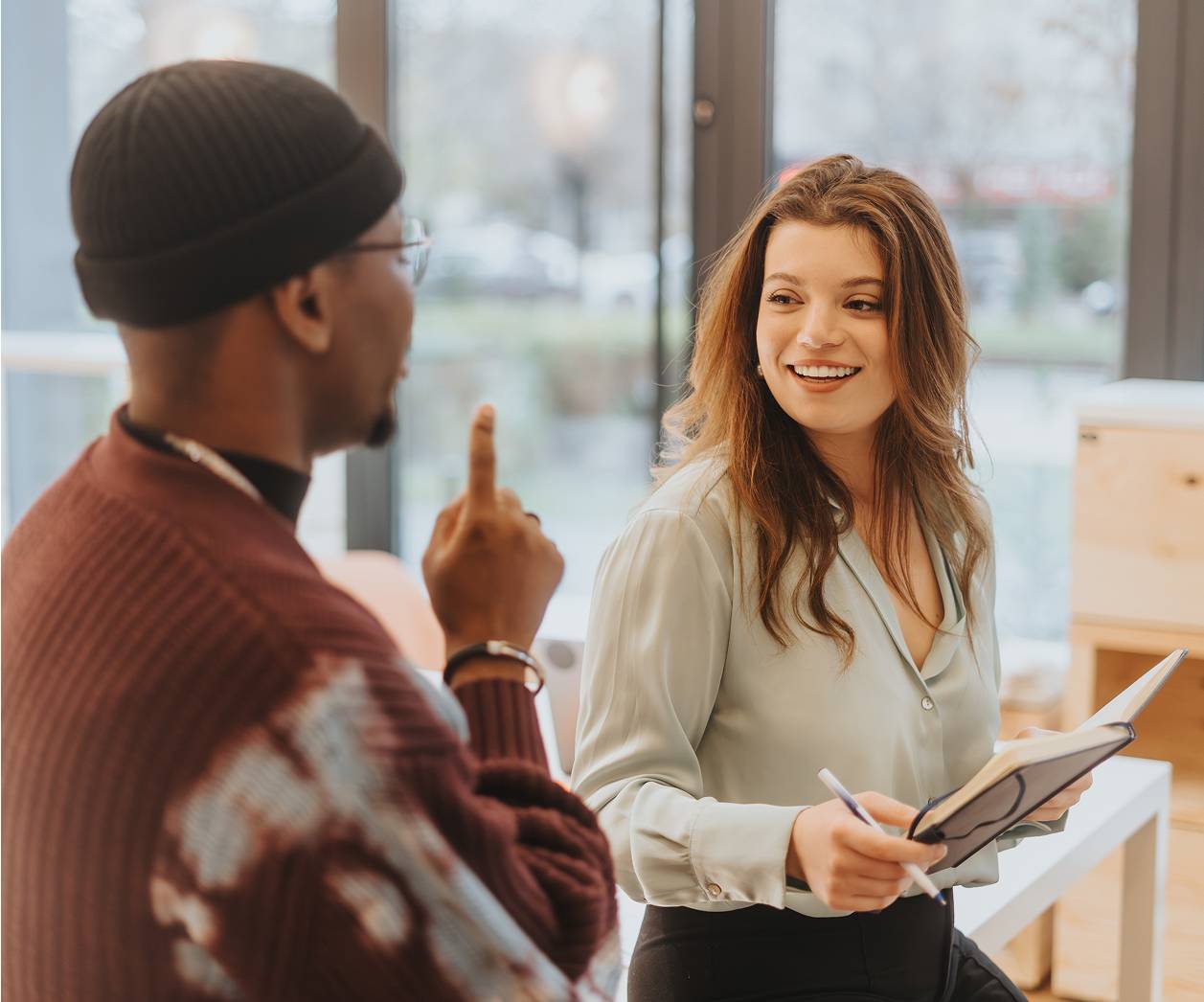 Man and woman talking in office