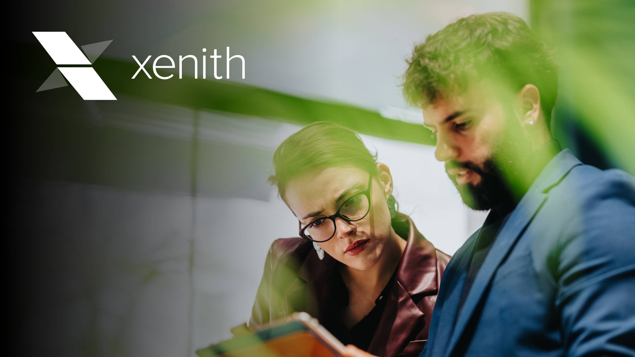 Two business people looking at tablet-featured