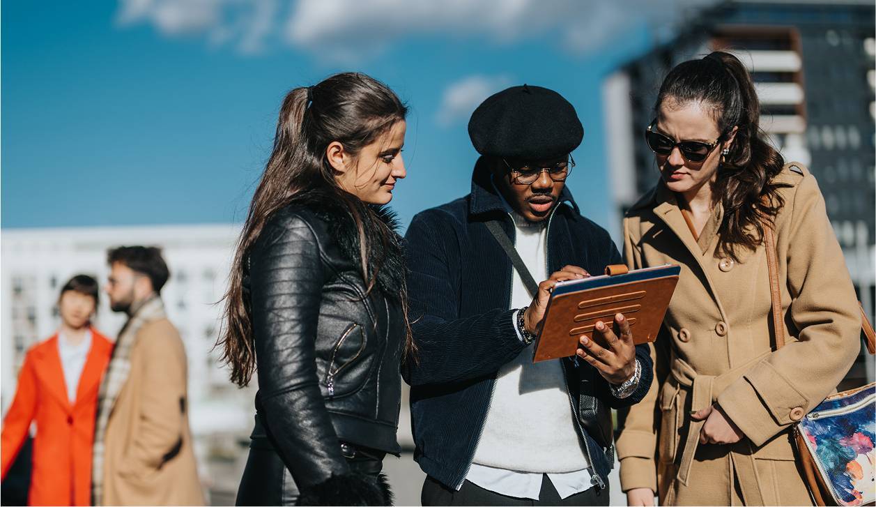 Group of young professionals using tablet outside-rectangle