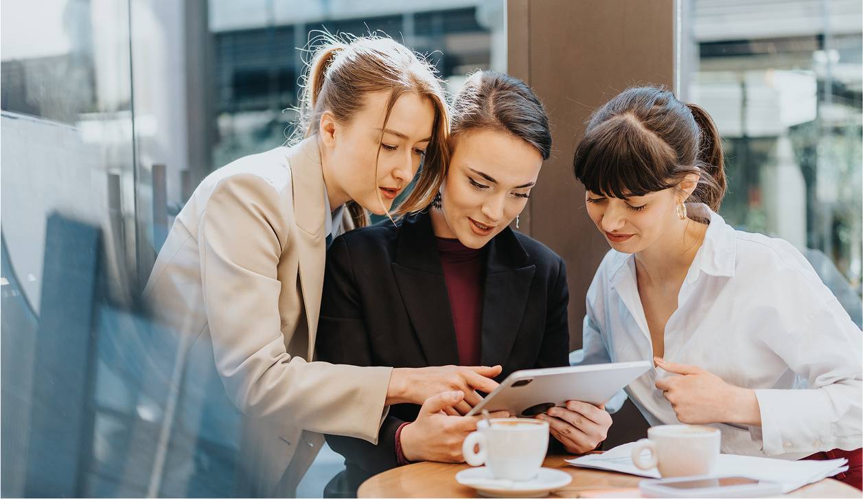 Three woman working together in a cafe-rectangle