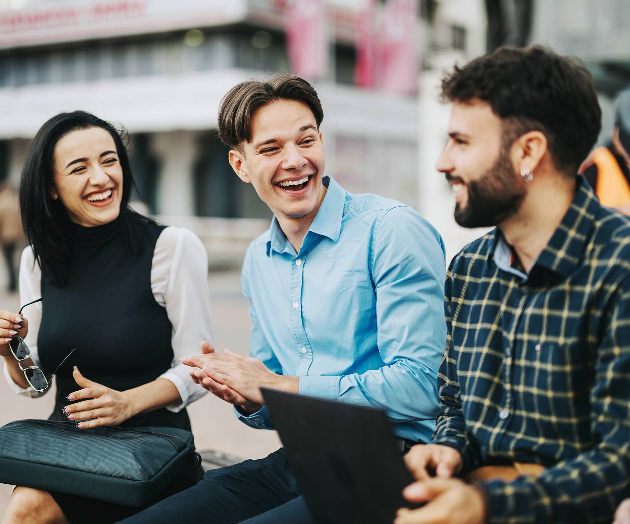 Group of young professionals talking outside